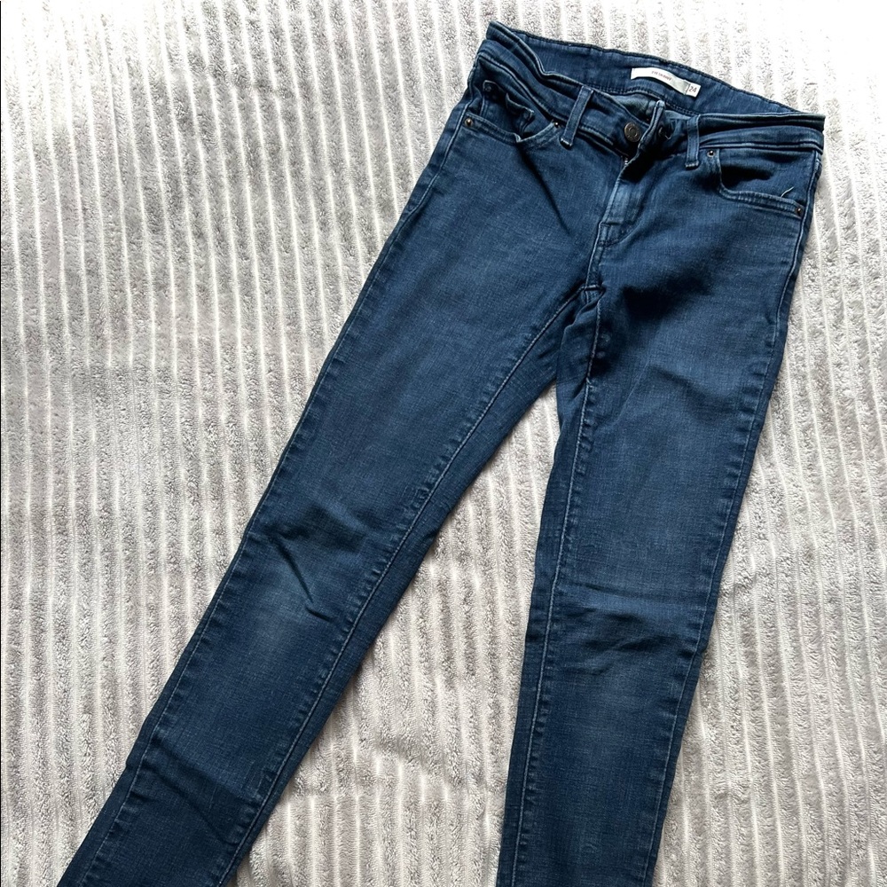 Levi’s 711 Skinny dark wash, mid rise jean.